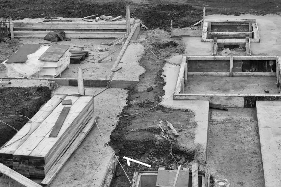 Aerial view of concrete foundations at a construction site.