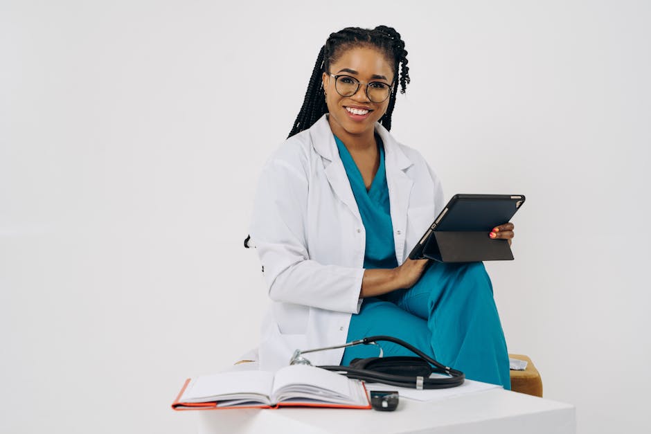 Smiling female doctor with a tablet and stethoscope in a bright office setting