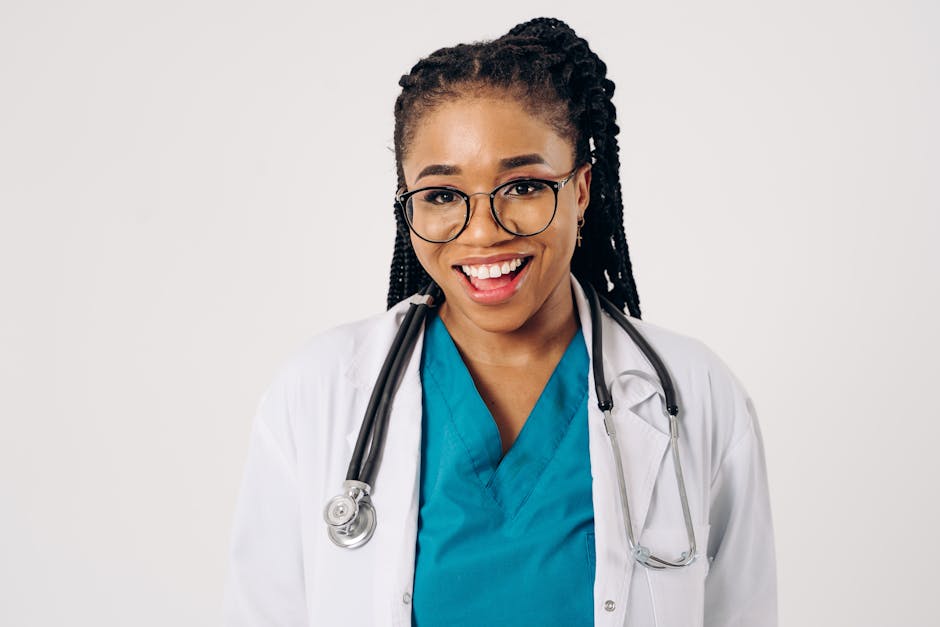 Portrait of a smiling female doctor in a lab coat and stethoscope, exuding confidence